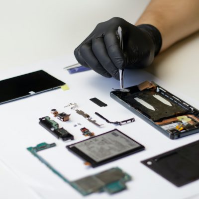 technician repairing the smartphone's motherboard in the lab. Mobile phone, electronic, repairing, u